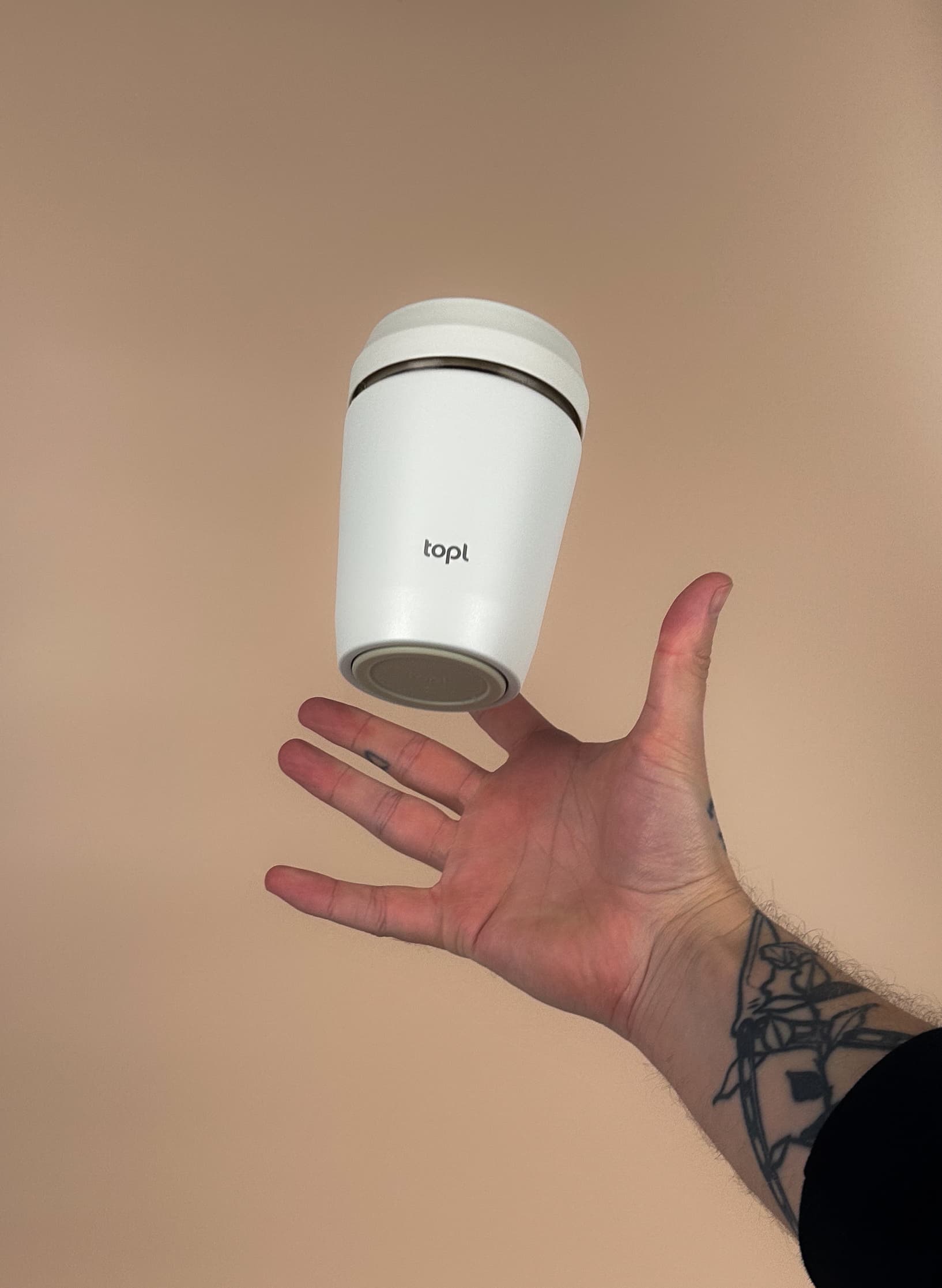 White topl To Go Tumbler in hand